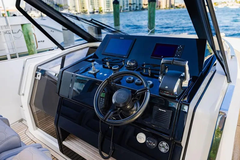  Yacht Photos Pics Cockpit of 2023 Astondoa 377 yacht with modern controls and steering wheel.