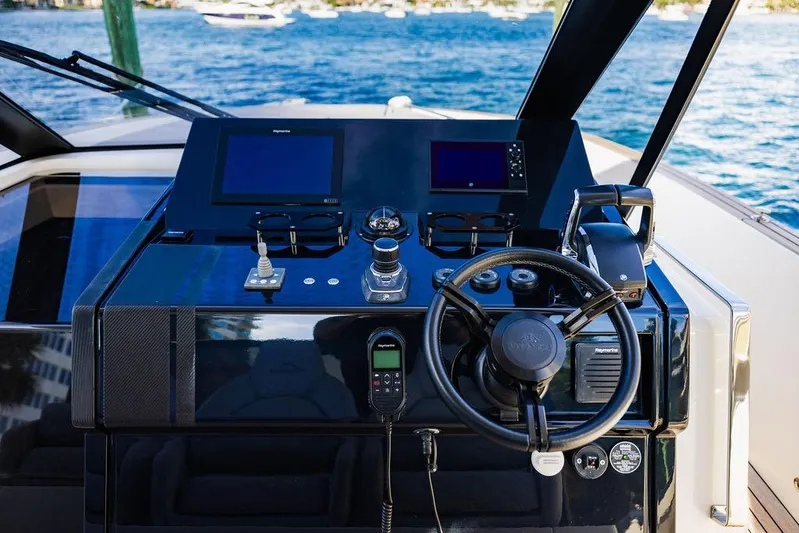  Yacht Photos Pics 2023 Astondoa 377 yacht helm with modern controls and ocean view.