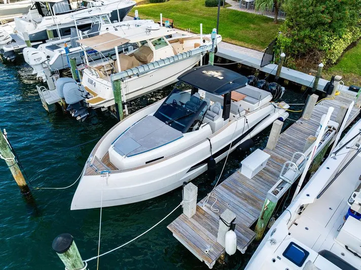  Yacht Photos Pics 2023 Astondoa 377 yacht docked at marina, featuring sleek design and modern amenities.