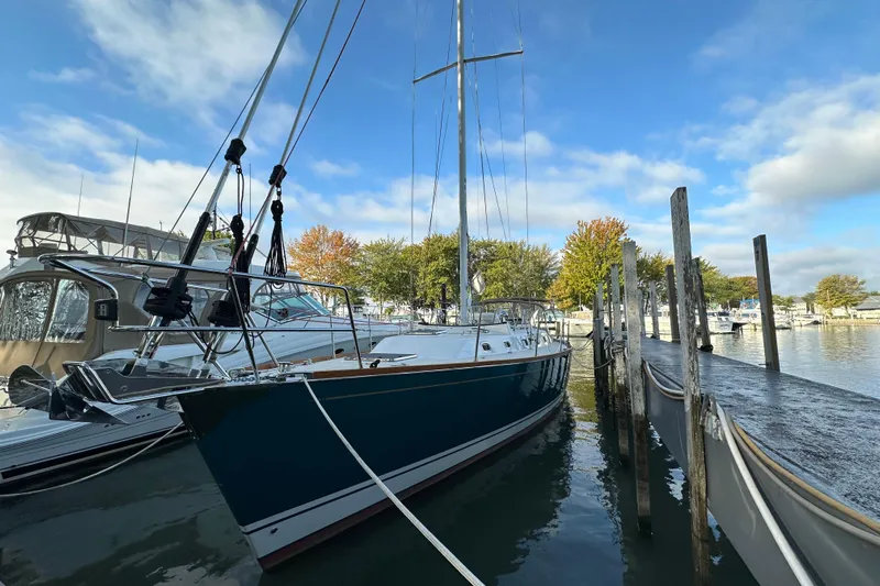  Yacht Photos Pics Sailboat Tartan 4300 (2017) docked at marina under blue sky.