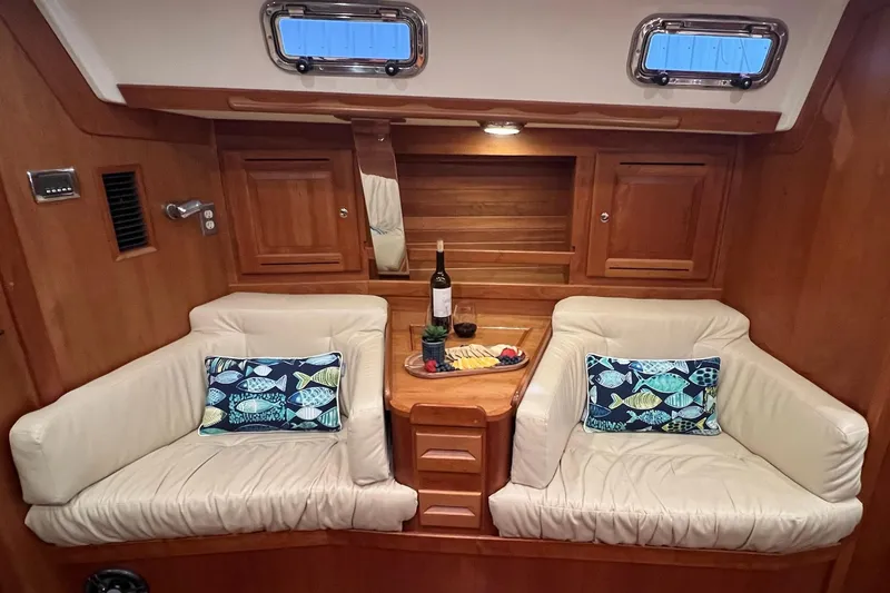  Yacht Photos Pics Luxurious 2017 Tartan 4300 yacht interior with cozy seating and nautical-themed pillows.