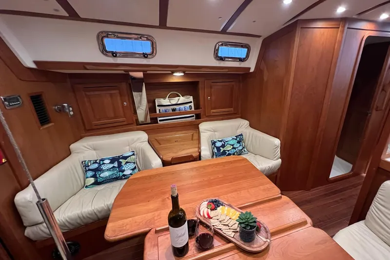  Yacht Photos Pics Luxurious 2017 Tartan 4300 yacht interior with cozy seating and elegant dining setup.