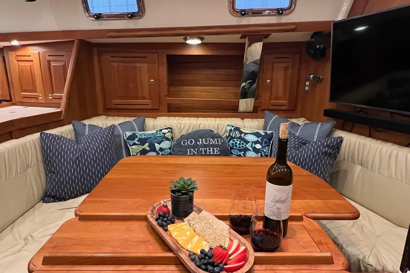  Yacht Photos Pics Luxurious 2017 Tartan 4300 yacht interior with wine, cheese platter, and cozy seating.