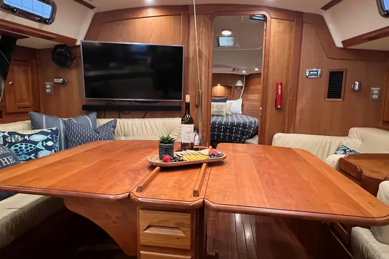 Yacht Photos Pics Luxurious 2017 Tartan 4300 yacht interior with dining area, TV, and cozy cabin.