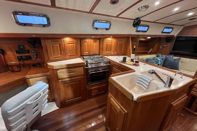  Yacht Photos Pics Luxurious 2017 Tartan 4300 yacht interior with wooden cabinetry and modern kitchen amenities.