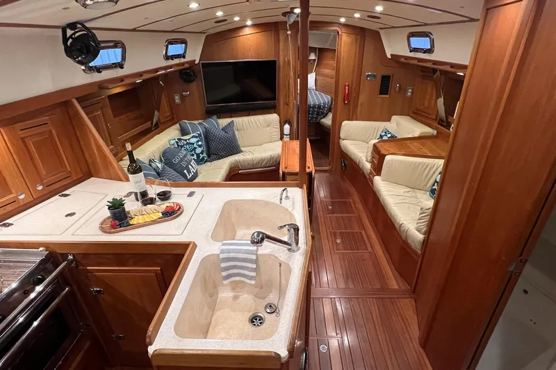  Yacht Photos Pics Luxurious 2017 Tartan 4300 yacht interior with elegant wood finish and cozy seating area.