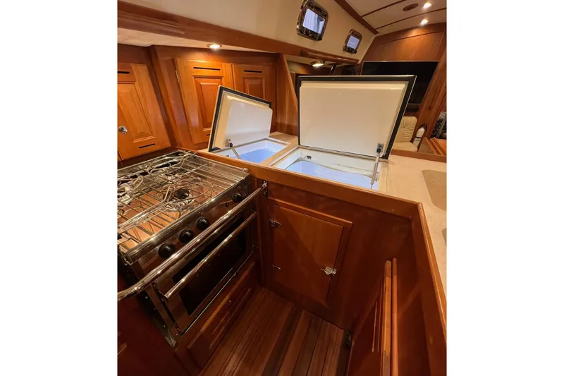  Yacht Photos Pics Luxurious 2017 Tartan 4300 yacht kitchen with stove and open fridge.