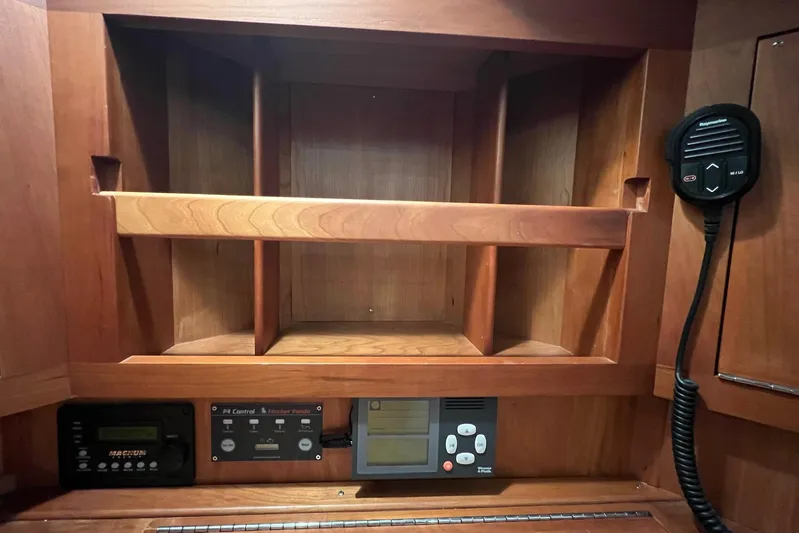  Yacht Photos Pics Wooden interior of 2017 Tartan 4300 yacht with control panels and radio.