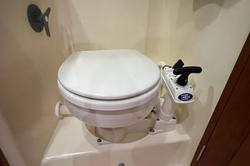  Yacht Photos Pics Marine toilet in a 2017 Tartan 4300 yacht, featuring a Jabsco manual pump.