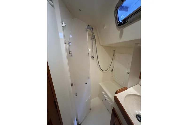  Yacht Photos Pics Bathroom interior of 2017 Tartan 4300 yacht with shower and sink.