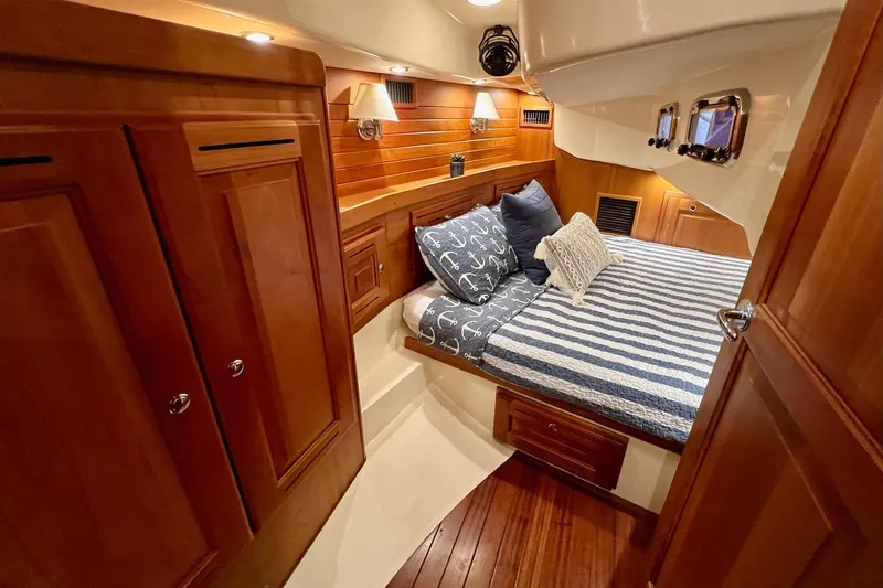  Yacht Photos Pics Luxurious 2017 Tartan 4300 yacht cabin with cozy bedding and elegant wood finishes.