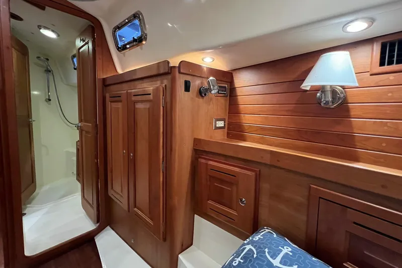  Yacht Photos Pics Luxurious 2017 Tartan 4300 yacht interior with wooden cabinetry and cozy lighting.