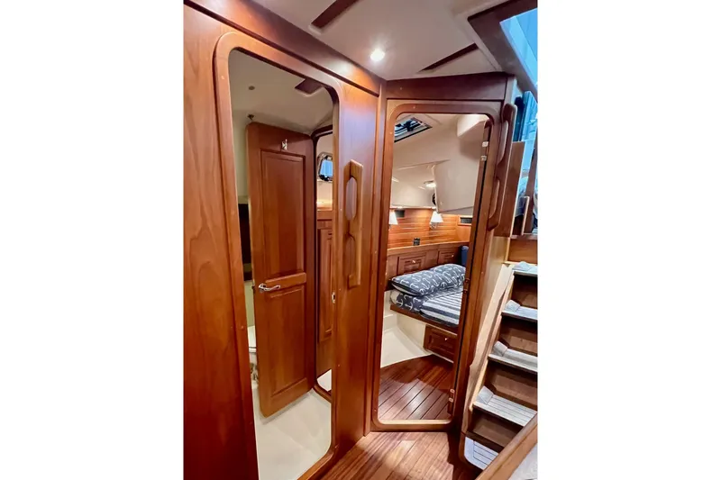  Yacht Photos Pics Luxurious interior of 2017 Tartan 4300 yacht with wooden finishes and cozy cabin.