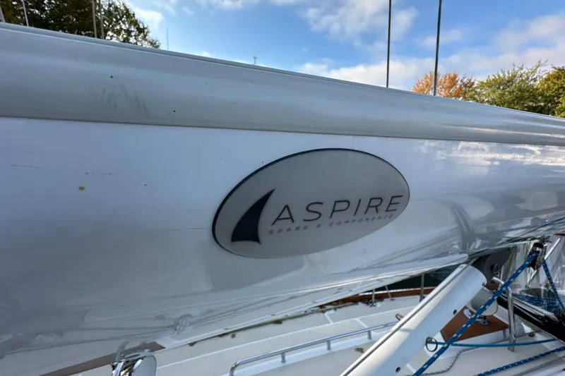  Yacht Photos Pics Sailboat mast with "Aspire" logo, Tartan 4300, 2017 model, under clear sky.