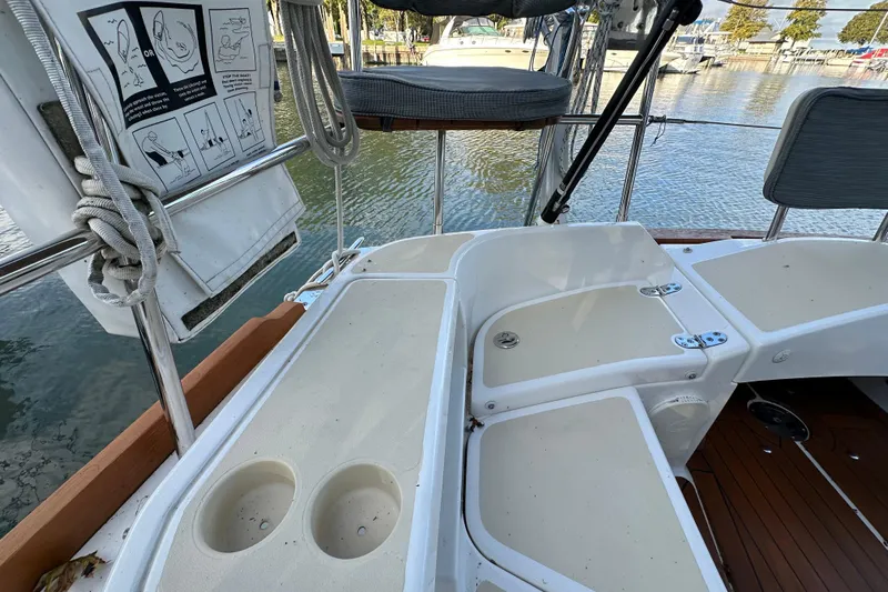  Yacht Photos Pics 2017 Tartan 4300 sailboat cockpit with seating and cup holders, docked at marina.