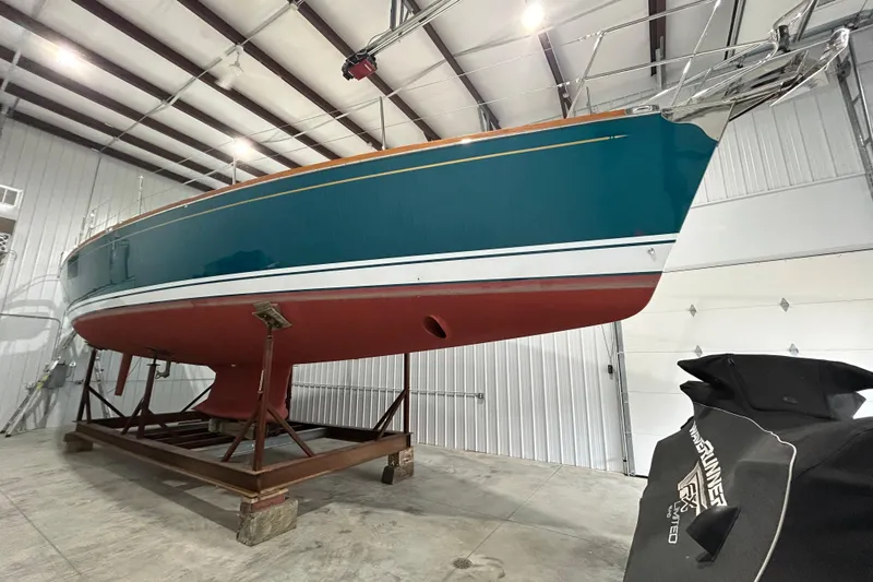  Yacht Photos Pics 2017 Tartan 4300 sailboat in storage, showcasing sleek design and vibrant colors.