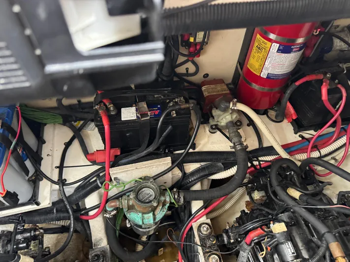 Idylwilde Yacht Photos Pics Engine compartment of a 2018 Sea Ray Sundancer 350 Coupe with visible wiring and components.