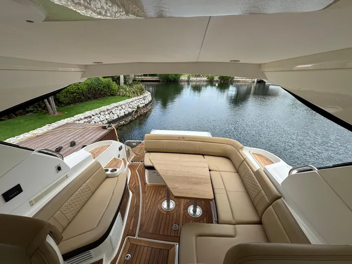 Idylwilde Yacht Photos Pics Luxurious interior of 2018 Sea Ray Sundancer 350 Coupe yacht with water view.