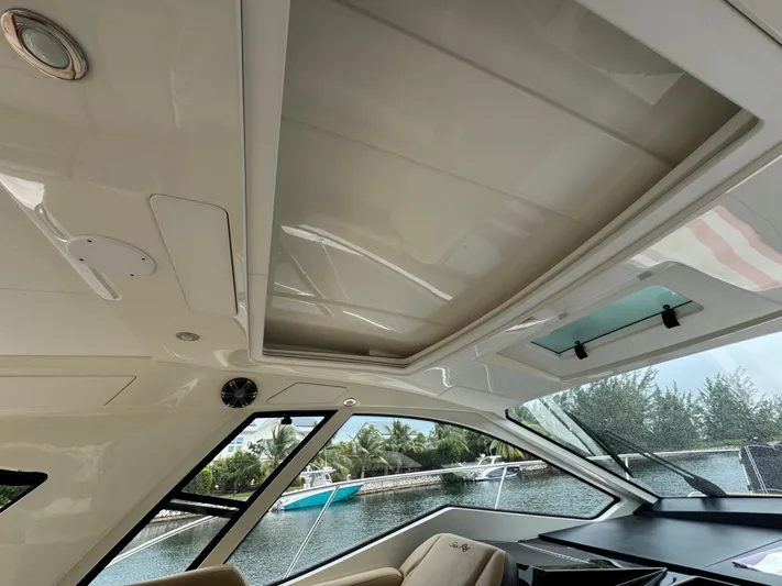 Idylwilde Yacht Photos Pics Interior view of 2018 Sea Ray Sundancer 350 Coupe with sunroof and scenic waterway.