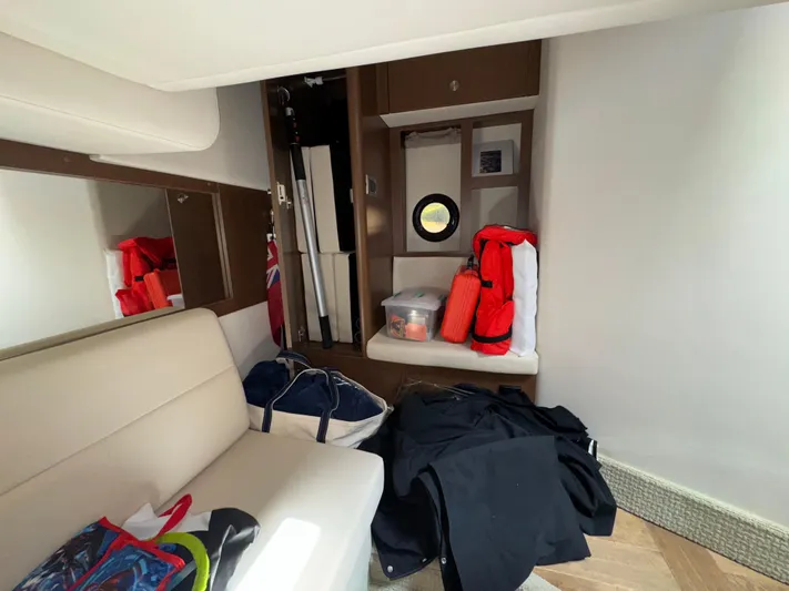 Idylwilde Yacht Photos Pics Interior of 2018 Sea Ray Sundancer 350 Coupe with seating, storage, and life jackets.
