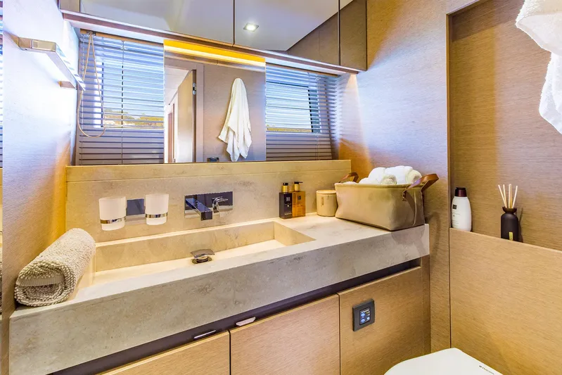  Yacht Photos Pics Luxurious bathroom interior on a 2016 Prestige 680 yacht, featuring modern fixtures and elegant design.