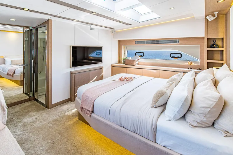  Yacht Photos Pics Luxurious bedroom interior of 2016 Prestige 680 yacht with modern decor and ocean view.