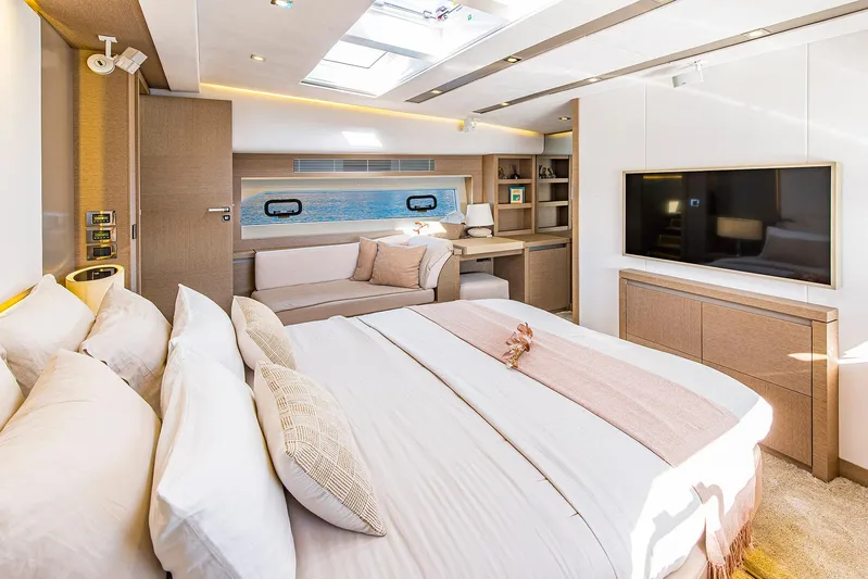  Yacht Photos Pics Luxurious bedroom interior of 2016 Prestige 680 yacht with modern decor and ocean view.