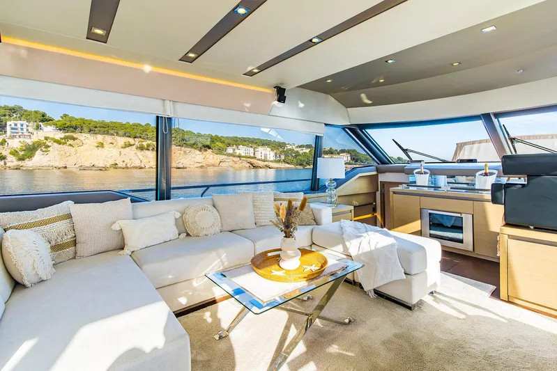  Yacht Photos Pics Luxurious interior of 2016 Prestige 680 yacht with modern furnishings and scenic ocean view.