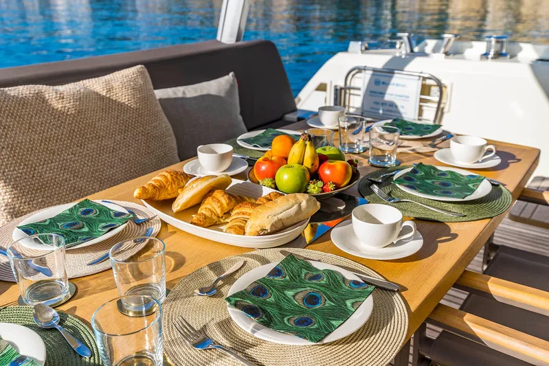 Yacht Photos Pics Luxurious breakfast setup on a 2016 Prestige 680 yacht, featuring fresh fruit and pastries.