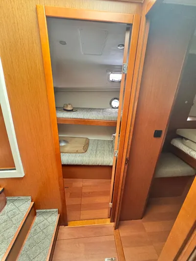 Amour Yacht Photos Pics Interior of 2018 Beneteau Swift Trawler 34 with wooden finish and bunk beds.