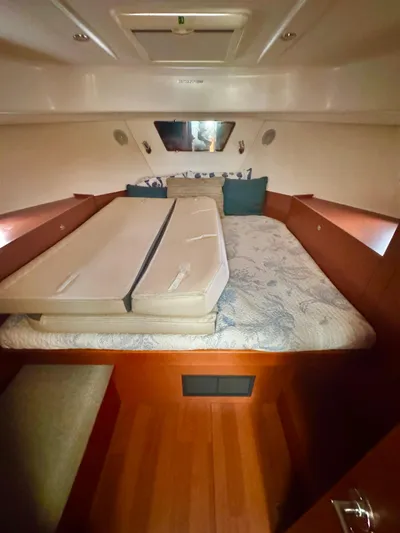 Amour Yacht Photos Pics 2018 Beneteau Swift Trawler 34 cabin interior with bed and cushions.
