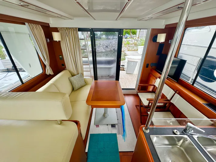 Amour Yacht Photos Pics Interior of 2018 Beneteau Swift Trawler 34, featuring cozy seating and modern amenities.