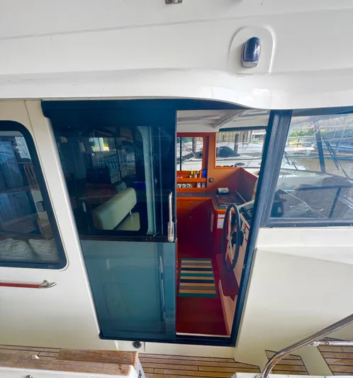 Amour Yacht Photos Pics 2018 Beneteau Swift Trawler 34 interior view with helm and seating area.