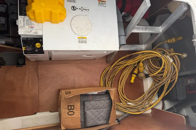 Amour Yacht Photos Pics Engine room of 2018 Beneteau Swift Trawler 34 with cables and equipment.