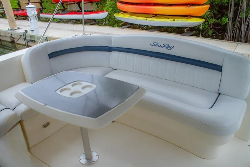 Flingstone 2006 Sea Ray 40 Da Yacht Photos Pics 2006 Sea Ray 40 Sundancer boat seating area with table and cup holders.