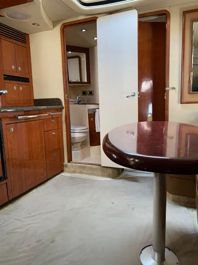 Flingstone 2006 Sea Ray 40 Da Yacht Photos Pics 2006 Sea Ray 40 Sundancer interior with kitchen, dining table, and bathroom view.