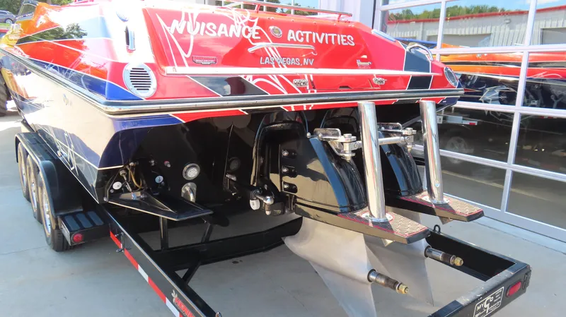  Yacht Photos Pics 2007 Fountain 42 Lightning boat on trailer, vibrant red and blue design, rear view.