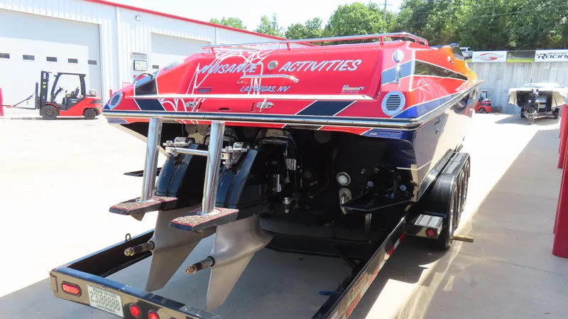  Yacht Photos Pics 2007 Fountain 42 Lightning speedboat on trailer, vibrant red and blue design, parked outdoors.