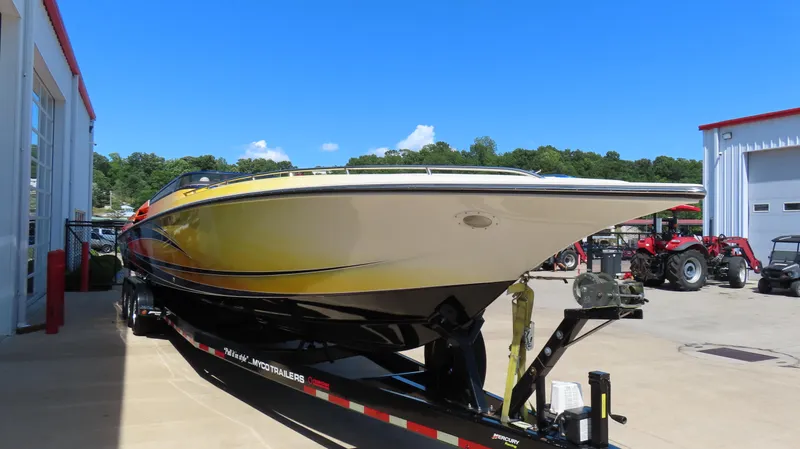 Yacht Photos Pics 2007 Fountain 42 Lightning boat on trailer, parked outdoors under clear blue sky.