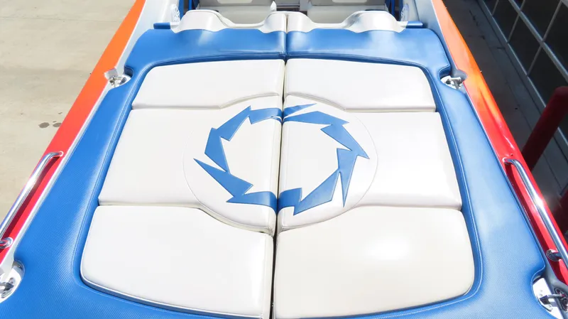  Yacht Photos Pics 2007 Fountain 42 Lightning boat with blue and white cushioned seating and logo design.