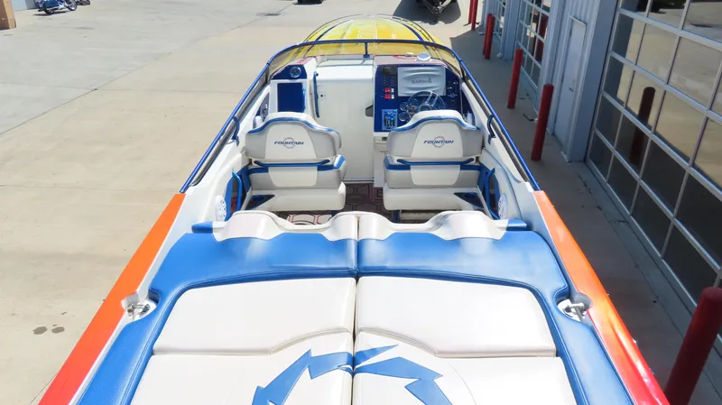  Yacht Photos Pics 2007 Fountain 42 Lightning boat interior with blue and white seating, vibrant design.