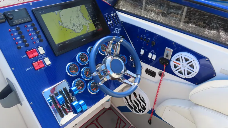  Yacht Photos Pics 2007 Fountain 42 Lightning boat dashboard with navigation system and controls.