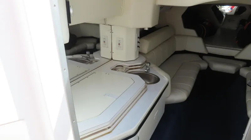  Yacht Photos Pics 2007 Fountain 42 Lightning boat interior with kitchenette and seating area.