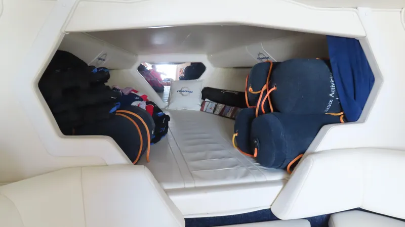  Yacht Photos Pics 2007 Fountain 42 Lightning cabin interior with cushions and storage.