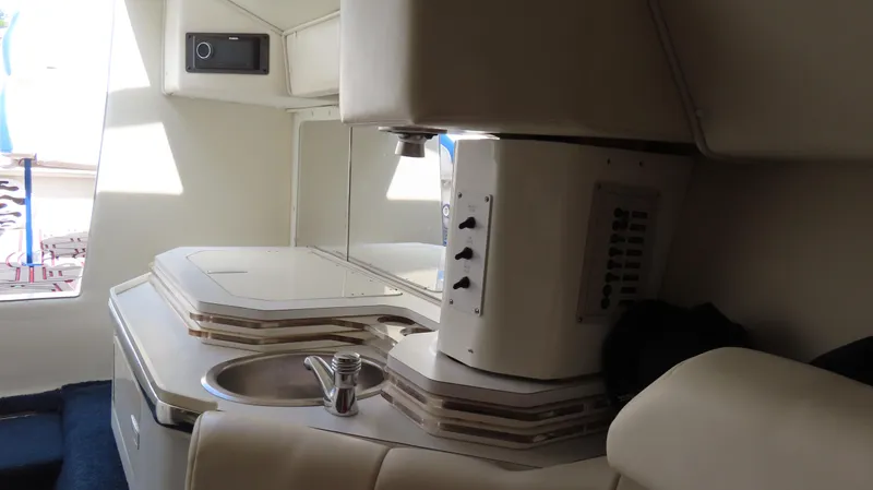  Yacht Photos Pics Interior of a 2007 Fountain 42 Lightning boat, featuring a compact kitchenette.