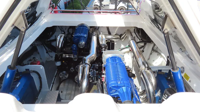  Yacht Photos Pics Engine compartment of a 2007 Fountain 42 Lightning boat, featuring dual blue engines.