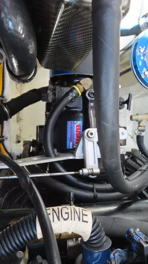  Yacht Photos Pics Engine components of a 2007 Fountain 42 Lightning boat, featuring hoses and mechanical parts.