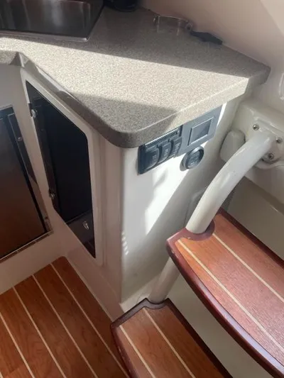  Yacht Photos Pics Interior of 2018 Regulator 41 boat with wooden steps and countertop.