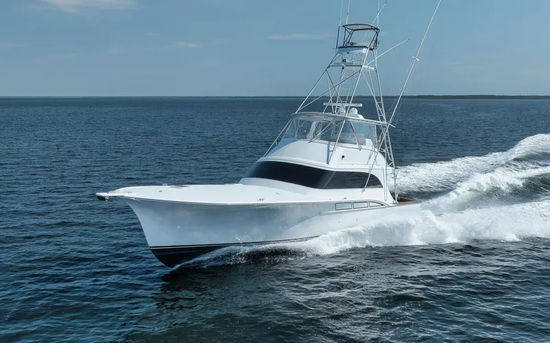 Knot Now Yacht Photos Pics 1997 Miller Marine Custom Carolina yacht cruising on open water.