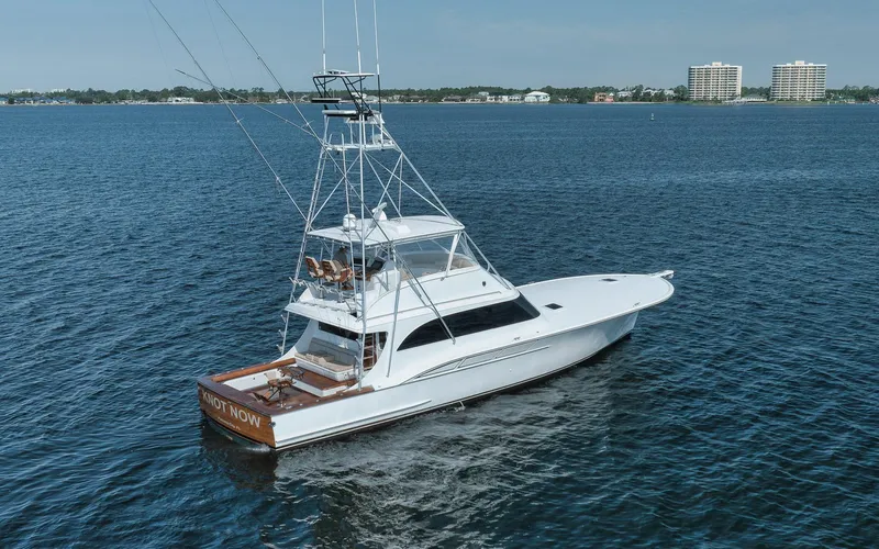 Knot Now Yacht Photos Pics 1997 Miller Marine Custom Carolina yacht on open water, clear sky background.